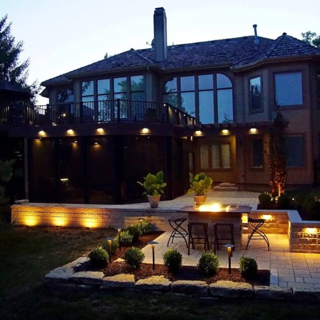 full view of lighting & fire pit landscape Kansas City